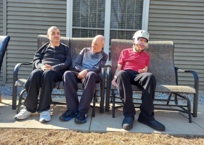Group Home Members Sitting Outside