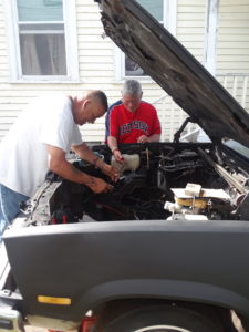 Men Fixing Car
