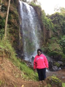 Sharifah In Kenya In Front Of Waterfall